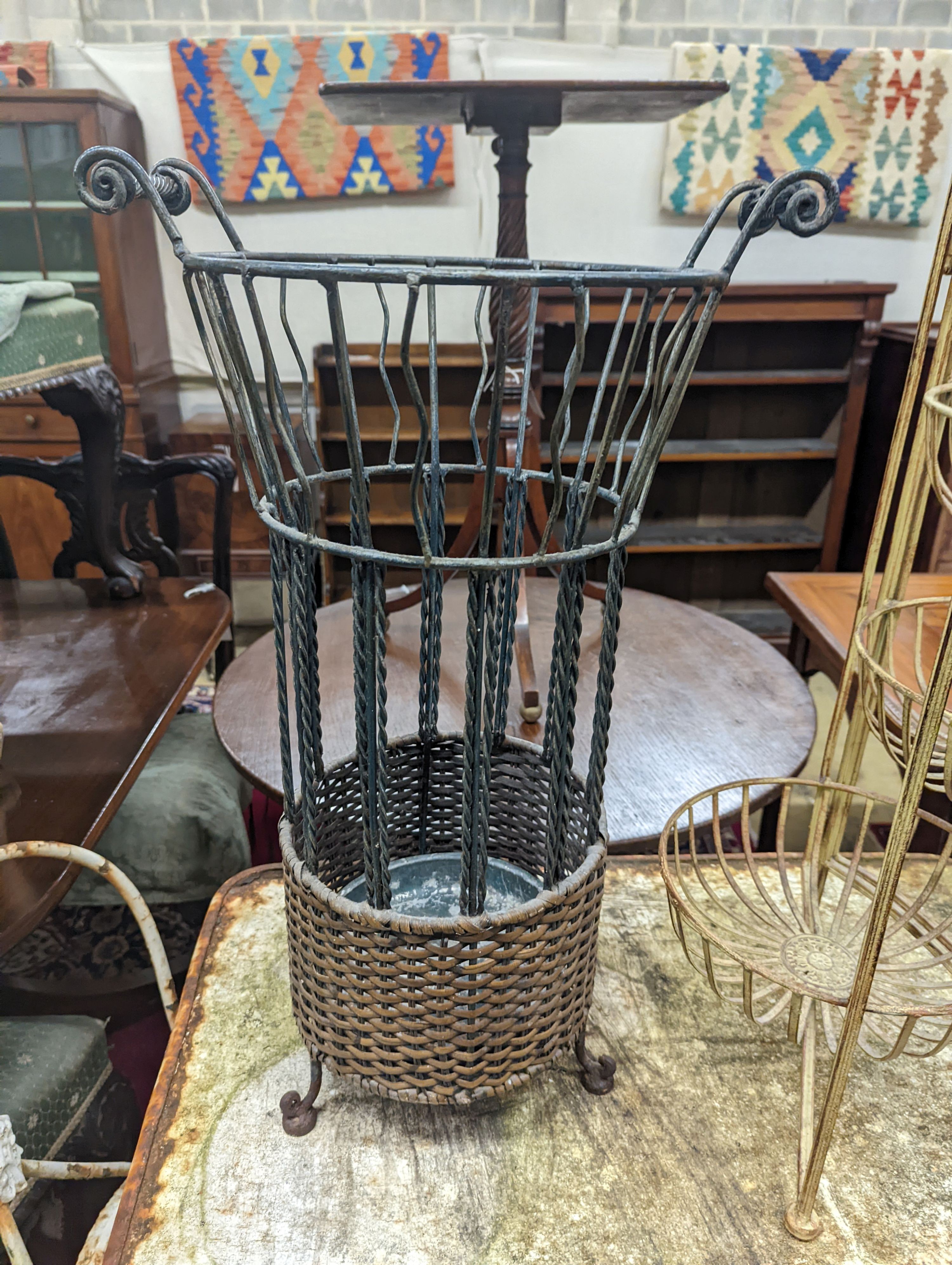 A rattan and wirework stick stand, height 63cm, together with one other folding stand